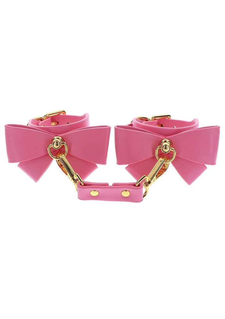 TABOOM | Malibu Wrist Cuffs – Esposas de Cuero Vegano Rosa con Lazo